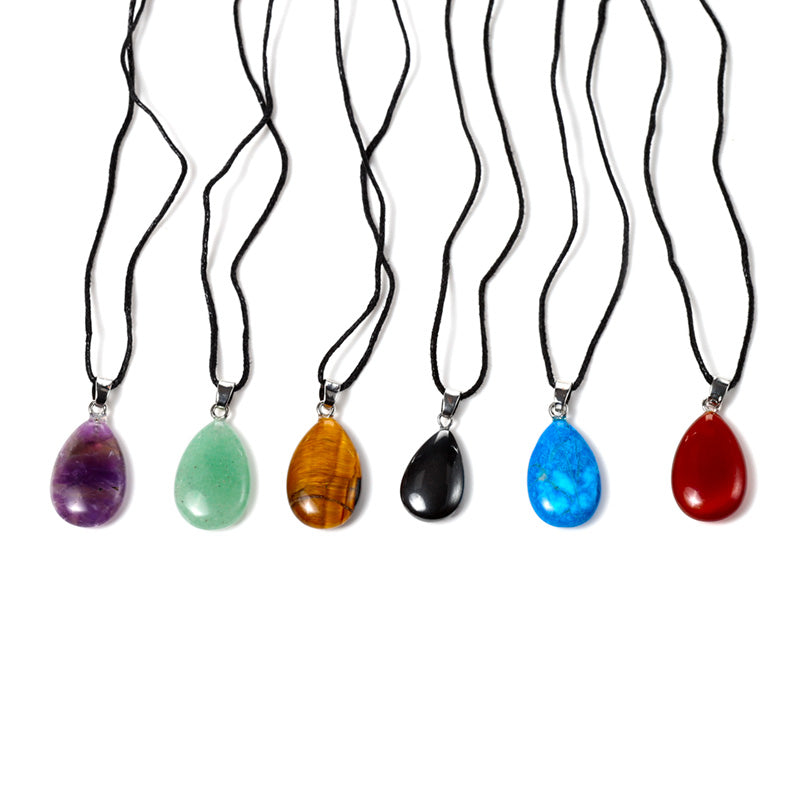 Teardrop gemstone pendant with brass setting