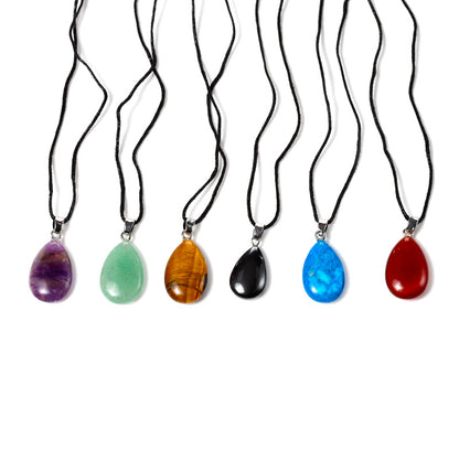 Teardrop gemstone pendant with brass setting