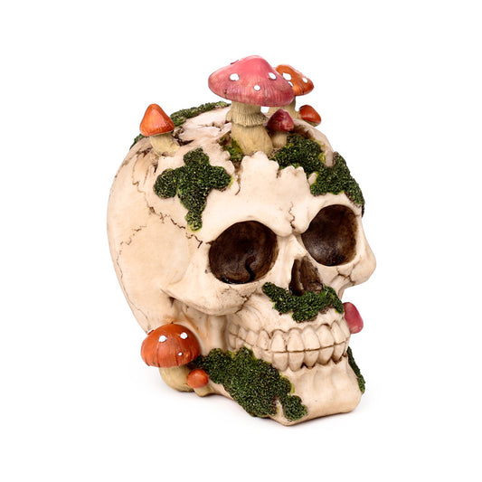 Decorative skull ornament with toadstools and moss