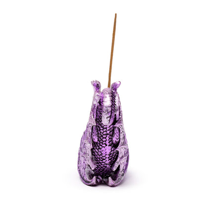 Decorative dragon incense burner displayed on a shelf
