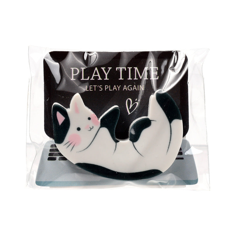 Cute Cat Nap Time Eraser on a creative desk