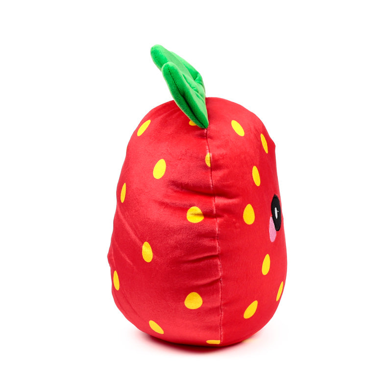 Squidglys Elidi the Strawberry plush toy in a cozy setting