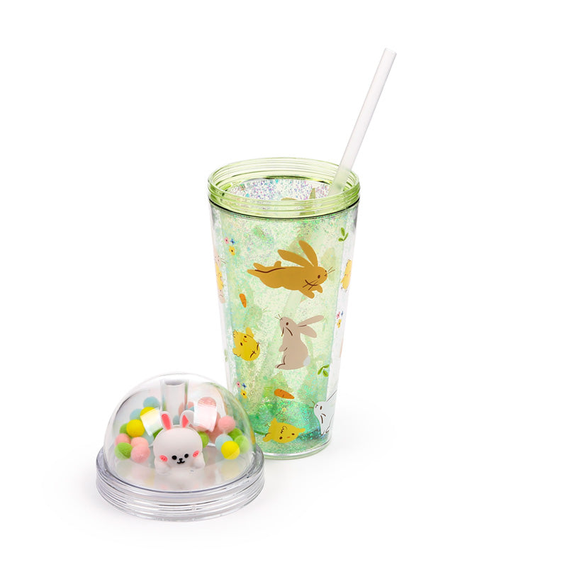 Close-up of springtime cup with decorative charms