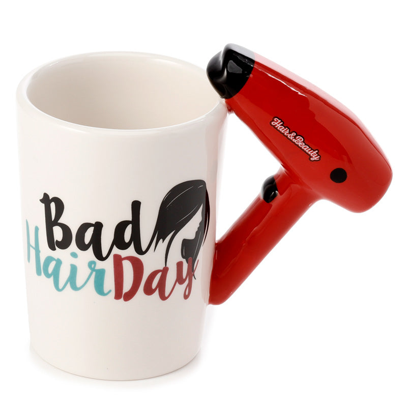 Close-up of hair drier ceramic mug handle