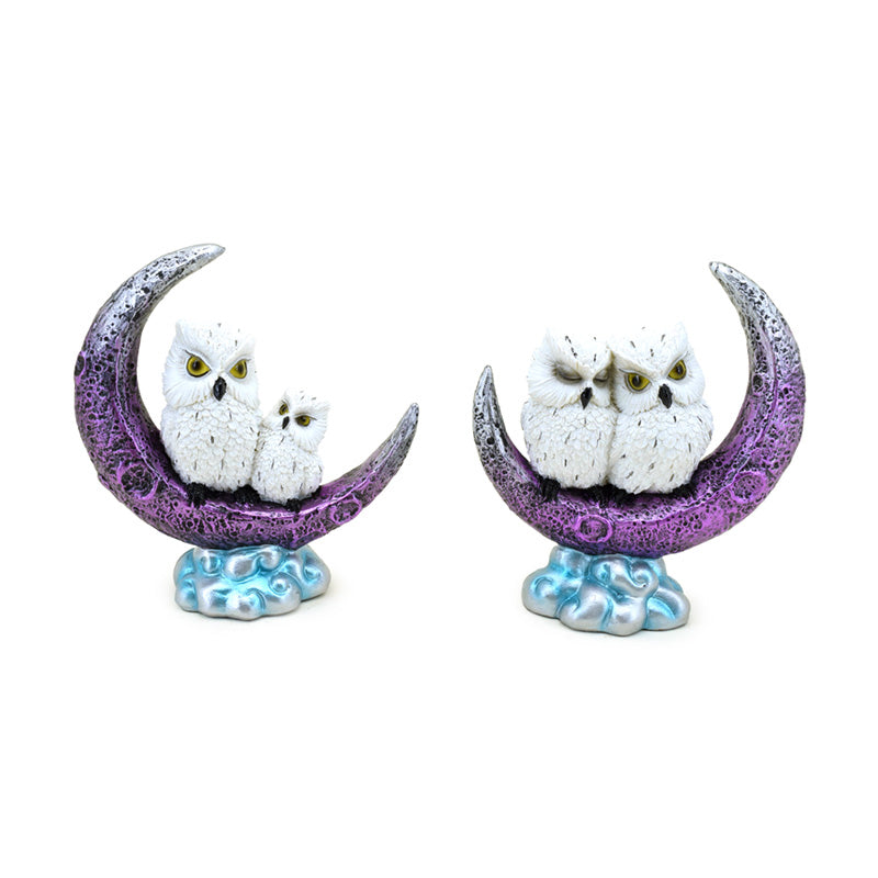Wise Old Magical Owl perched on a crescent moon decorative ornament
