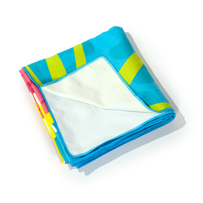 Vibrant unicorn beach towel for poolside relaxation
