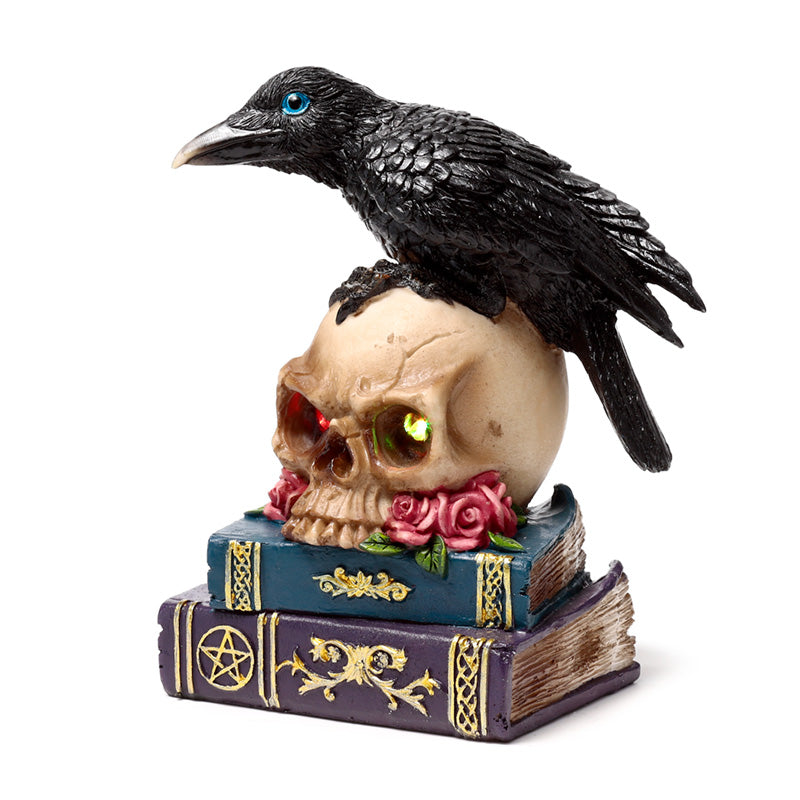 Gothic LED ornament featuring crow and books
