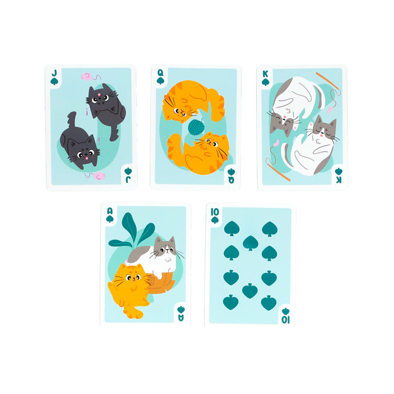 Playing cards displayed with cat-themed decor