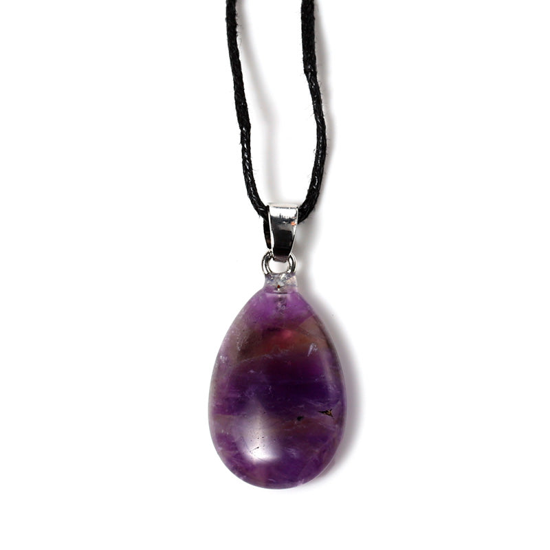 Teardrop gemstone pendant displayed elegantly