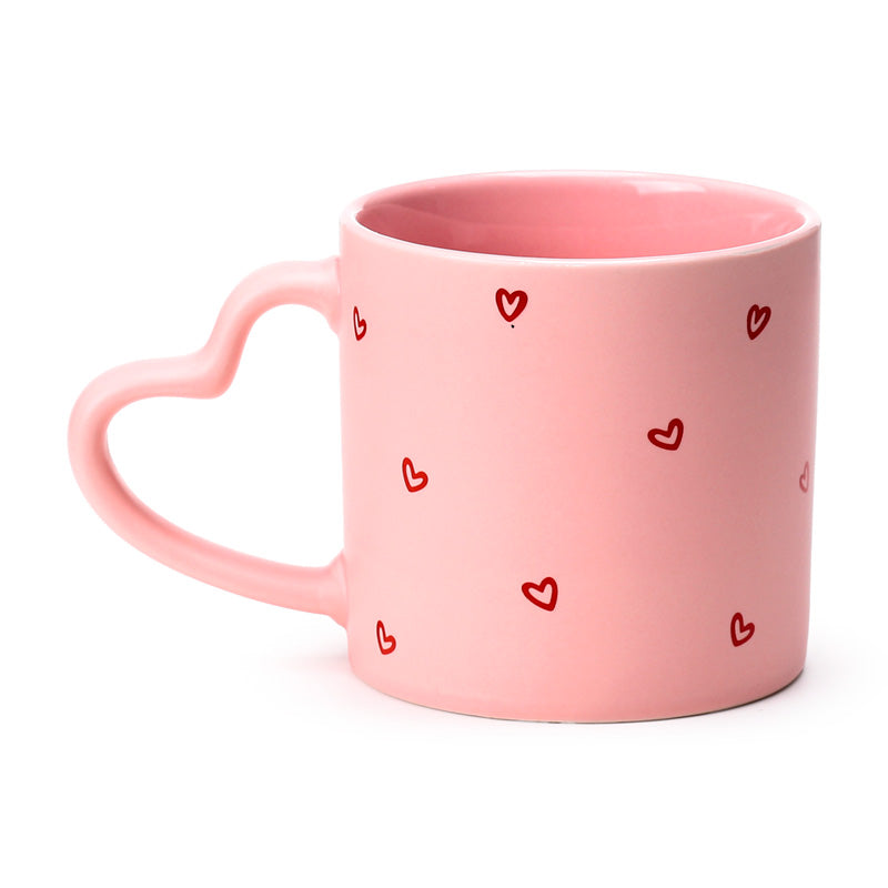Amore Heart Shaped Handle Mug on a decorative shelf