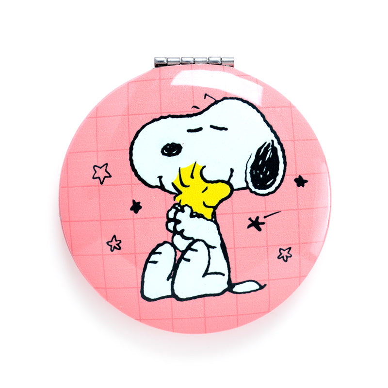 Peanuts Snoopy & Woodstock Compact Mirror on a vanity