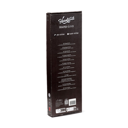 Guitar shaped wall clock displayed in a music studio