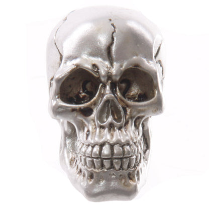 Glossy skull ornament with seasonal decorations