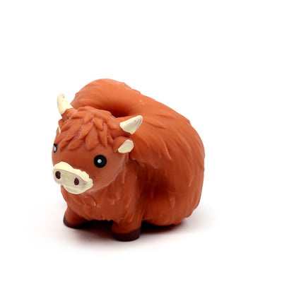 Child playing with Highland Coo Stretchy Fidget Toy