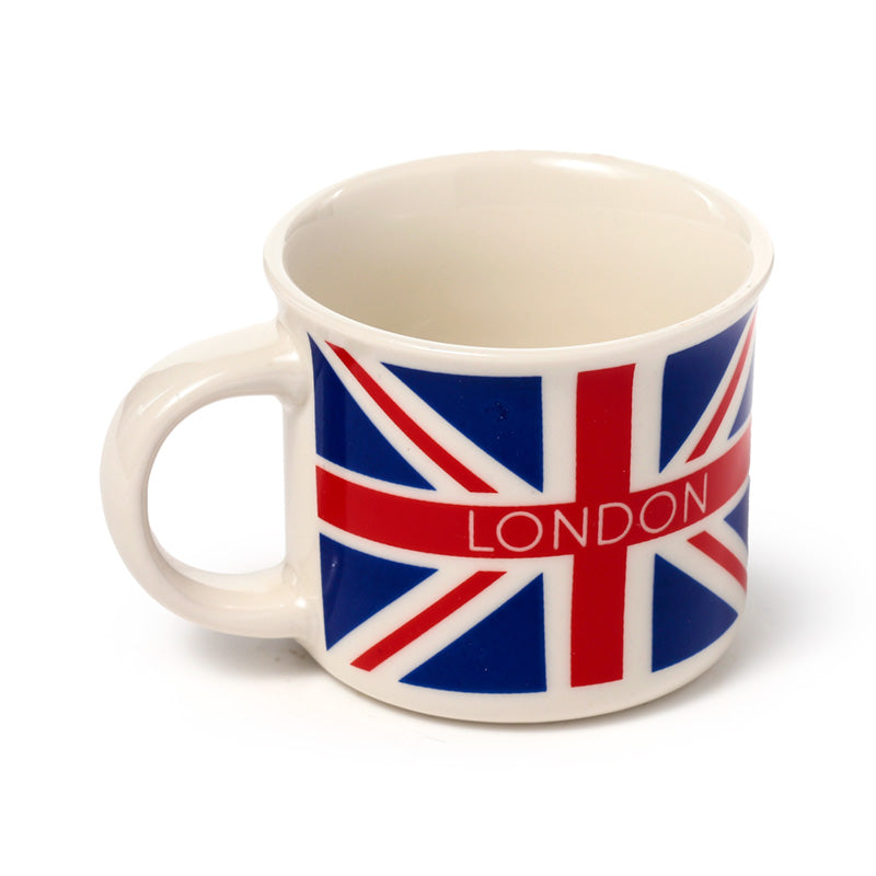 Close-up of London Icons espresso cups on a wooden table