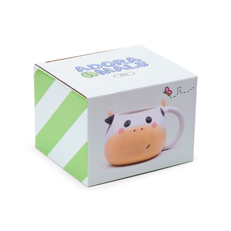 Ceramic head mug featuring a cow design