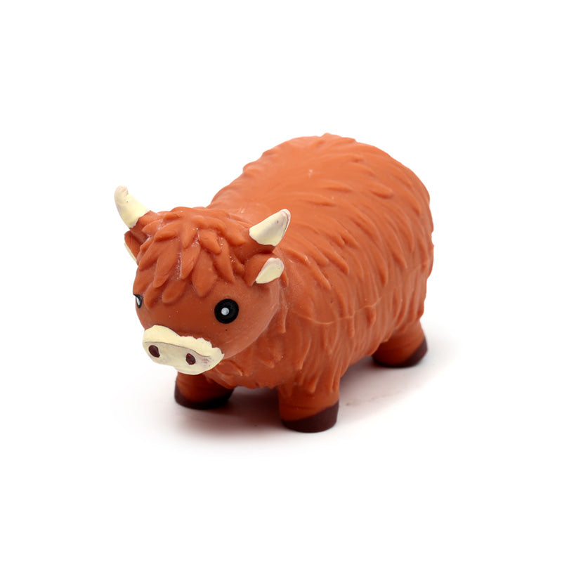 Highland Coo Stretchy Fidget Toy displayed on a table