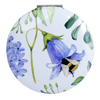 Elegant Compact Mirror - Nectar Meadows on a vanity
