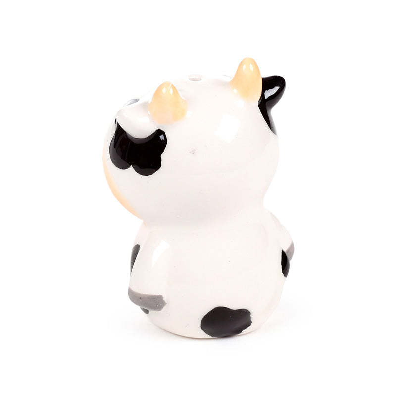 Ceramic salt and pepper set styled on a dining table