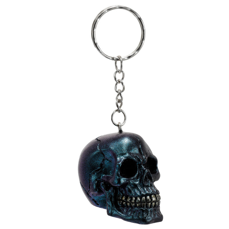 Skulls and Roses Metallic Skull Keyring on a table