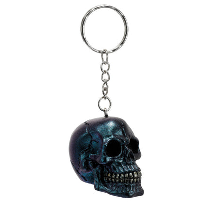 Skulls and Roses Metallic Skull Keyring on a table