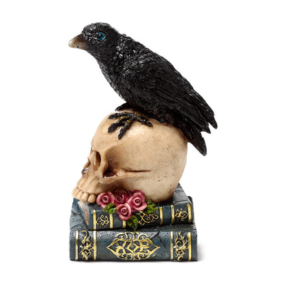 Decorative ornament showcasing a crow on a skull