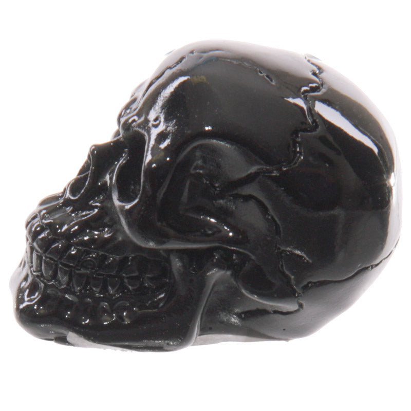 Unique glossy skull ornament on a table