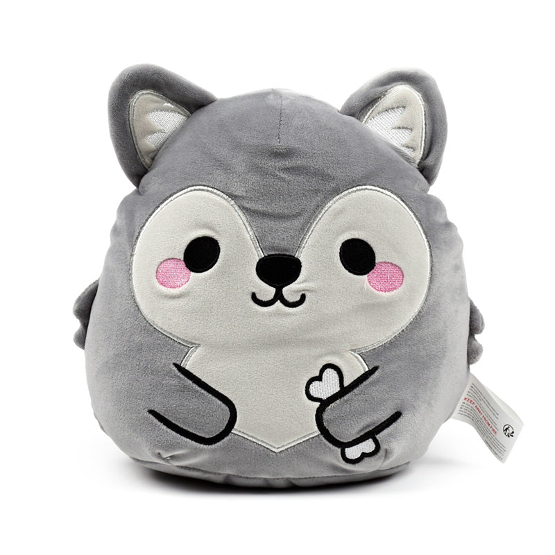 Dorian the Wolf plush toy displayed on a shelf
