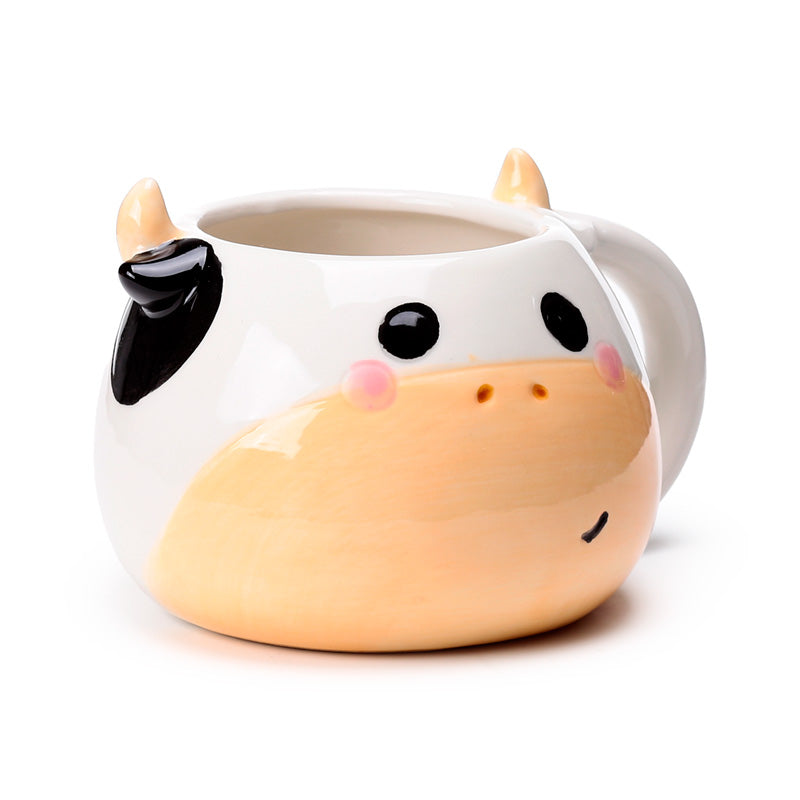 Black and white cow shaped ceramic mug