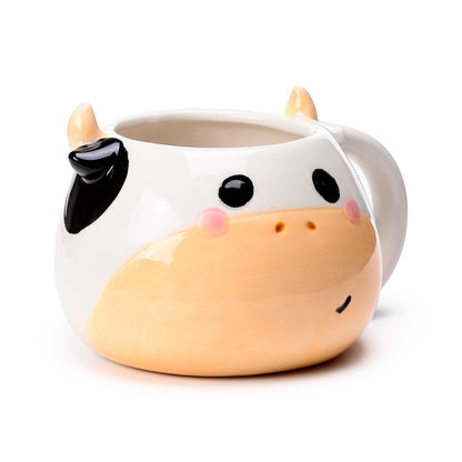 Black and white cow shaped ceramic mug