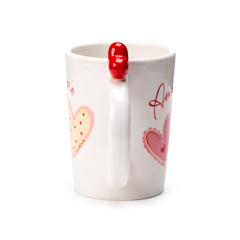 Amore Heart Shaped Handle Ceramic Mug with hot chocolate