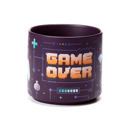 Game Over Mug displayed with decorative items