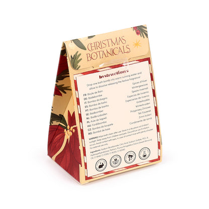 Christmas Botanicals Bath Bomb surrounded by holiday decor