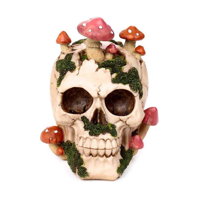 Close-up of skull ornament featuring whimsical toadstools