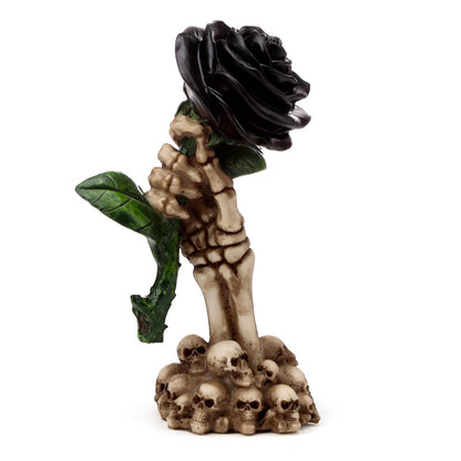 Close-up of Gothic Skull Decoration with Black Rose