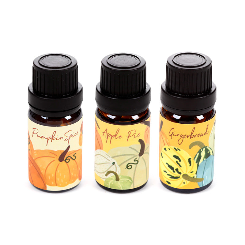 Elegant glass vials of Autumn Harvest fragrance oils