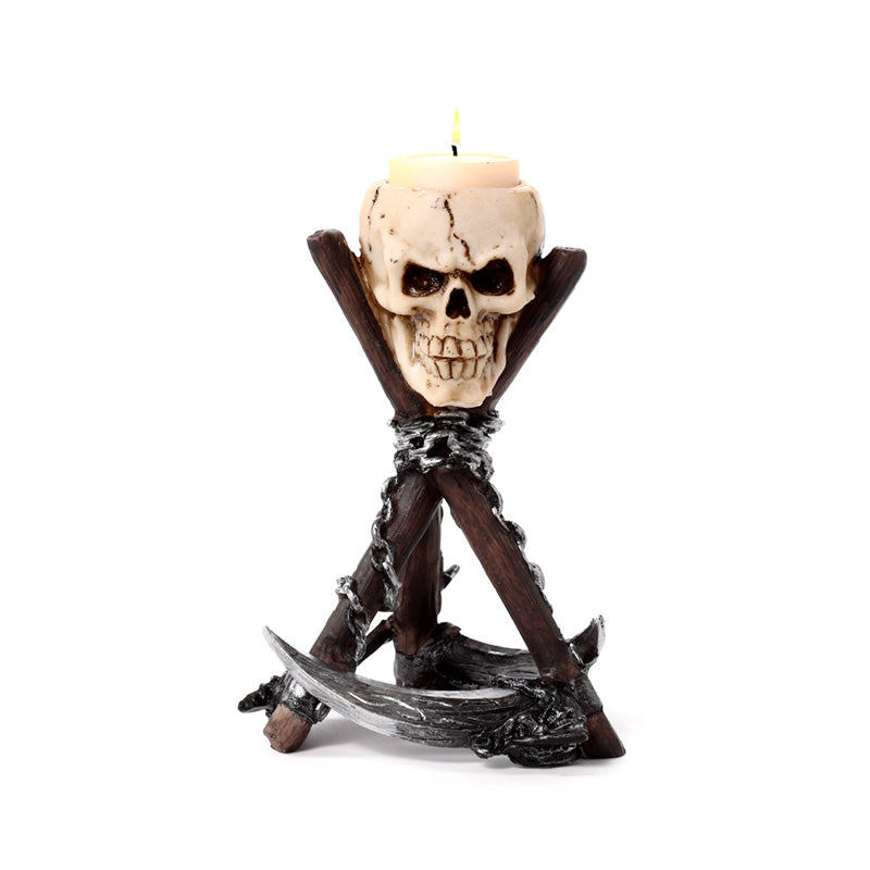 Detailed resin skull tea light holder showcasing scythe design
