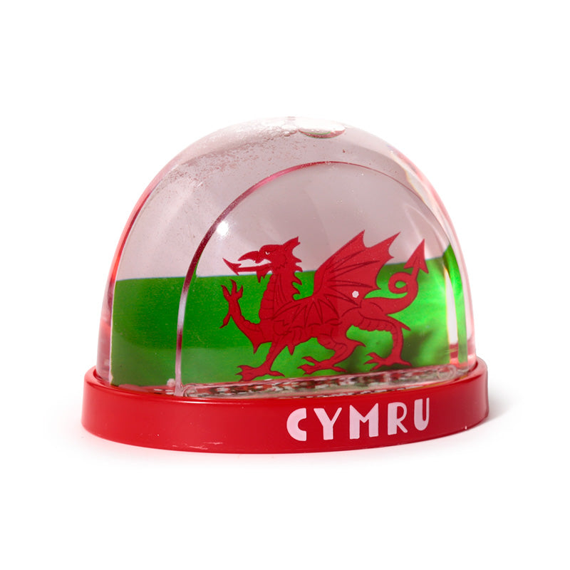 Shimmering snowflakes in Welsh Dragon Snow Globe