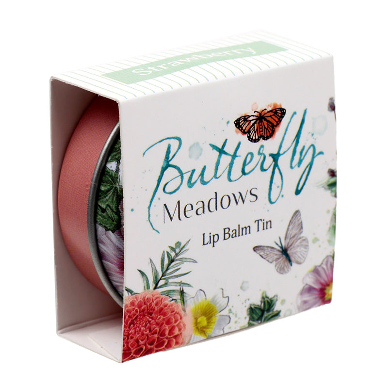 Butterfly Meadows Lip Balm surrounded by decorative items