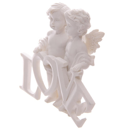 Cherub couple nestled together with LOVE letters