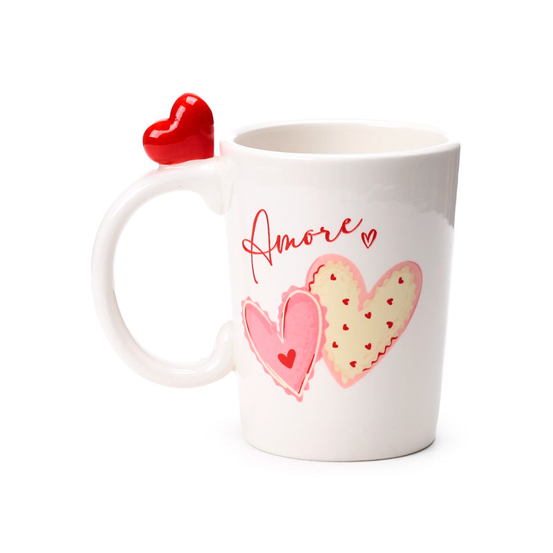 Amore Heart Shaped Handle Ceramic Mug displayed on a table