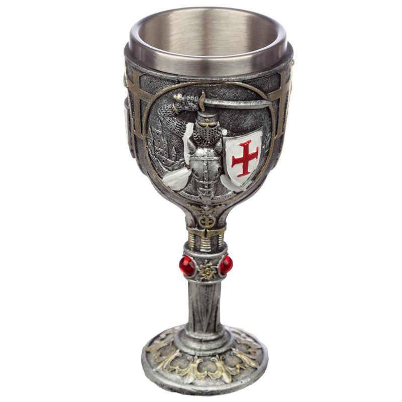 Decorative goblet displayed on a shelf with medieval decor