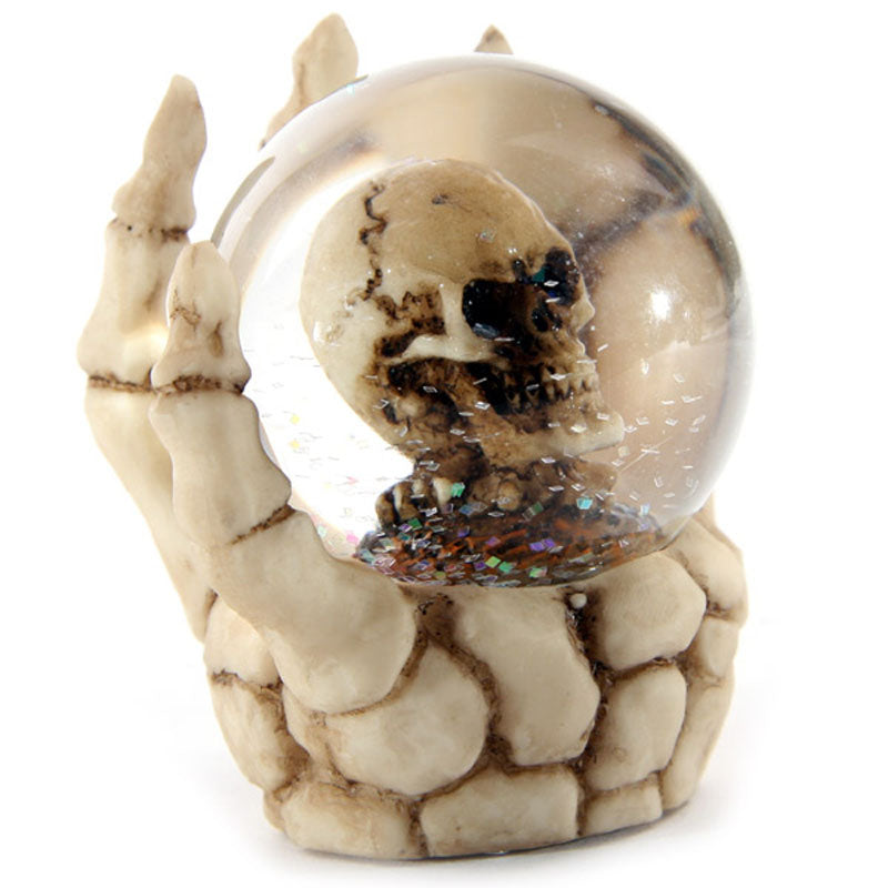 Snow globe featuring Skeleton Hand and Skull