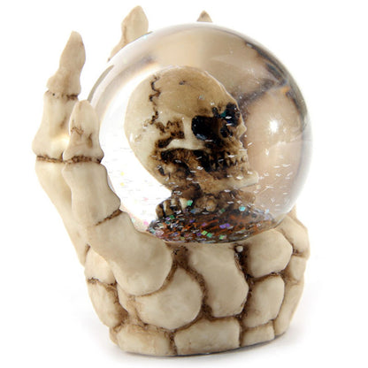 Snow globe featuring Skeleton Hand and Skull