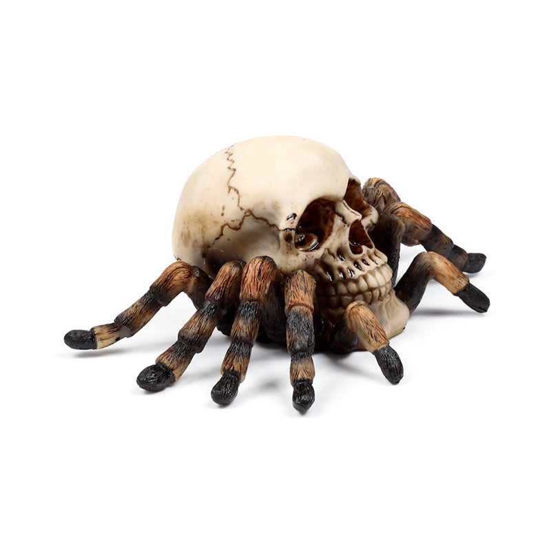 Collectible skull ornament with spider legs