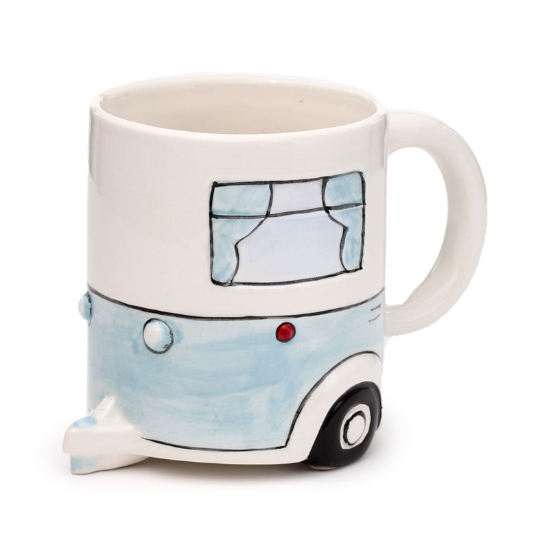 Ceramic mug showcasing whimsical caravan design