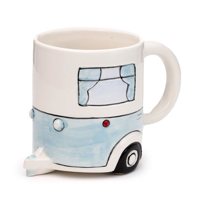 Ceramic mug showcasing whimsical caravan design