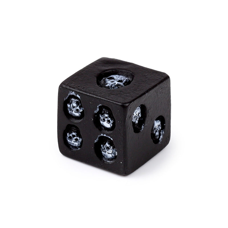 Gothic themed Black Skull Dice in a decorative setting