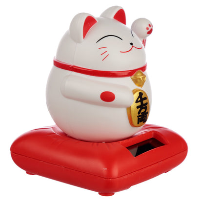 Charming waving cat ornament in garden